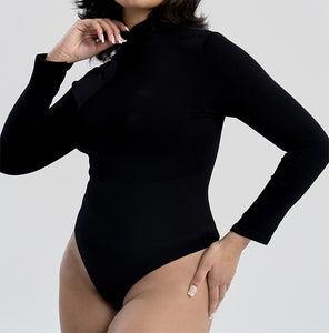 Turtleneck Bodysuit | This model is wearing a size L