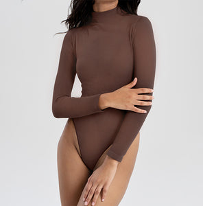 Turtleneck Bodysuit | This model is wearing a size XXS